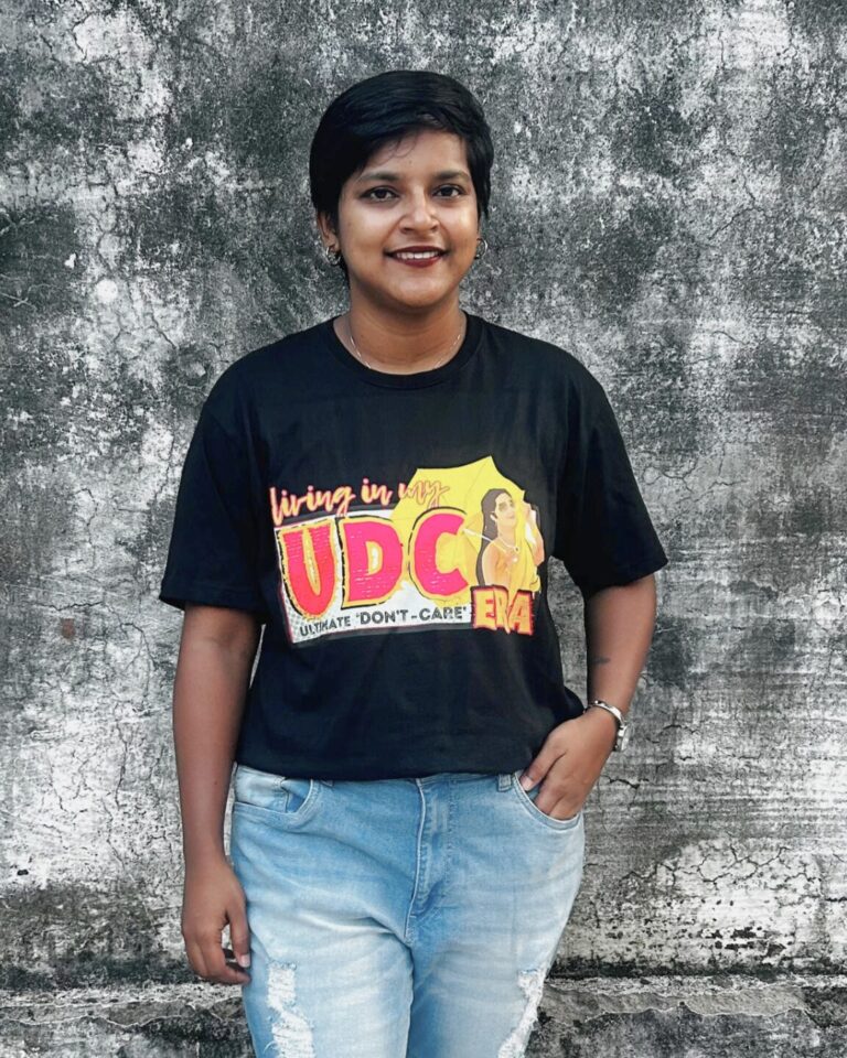 Happy customer wearing Parishkaaree T-shirt with Malayalam dialogue print.