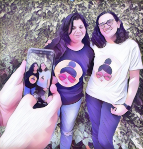 Parishkaaree founders, two women entrepreneurs showcasing T-shirts.